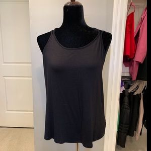 LuLus black tank with criss cross straps in the ba